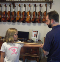 Glen measures a new violinist for an instrument